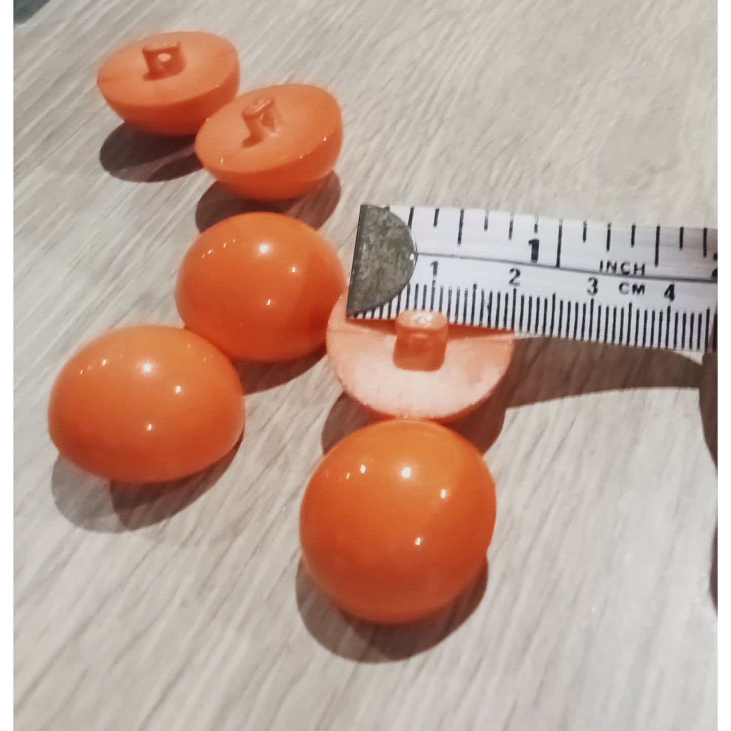 Orange round top button