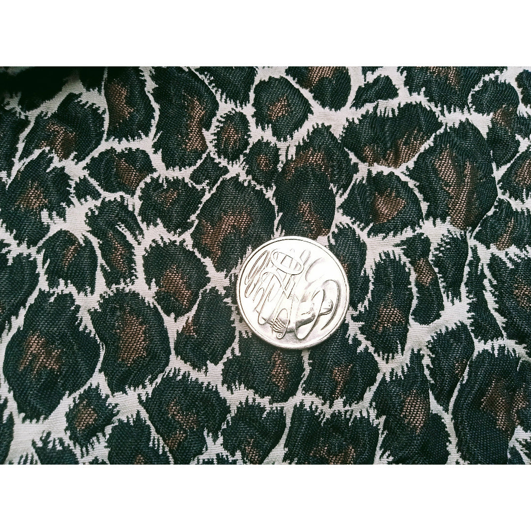 Leopard printed woven fabric - sold by 1/2mtr