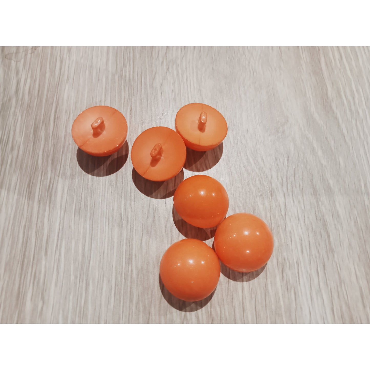 Orange round top button
