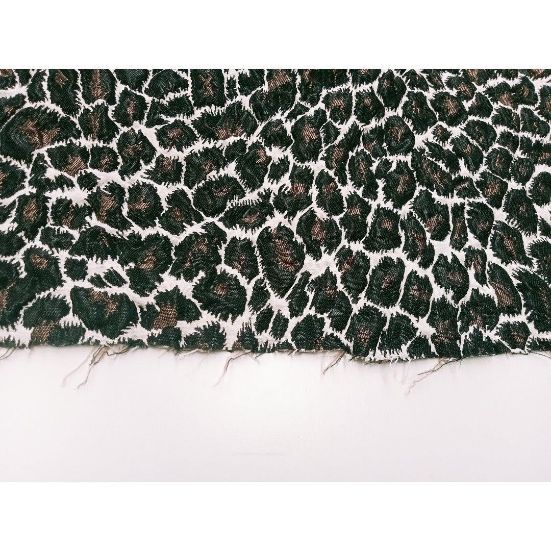 Leopard printed woven fabric - sold by 1/2mtr