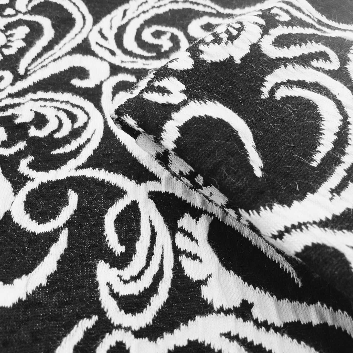 Jacquard design fabric - black/ivory sold by 1/2mtr