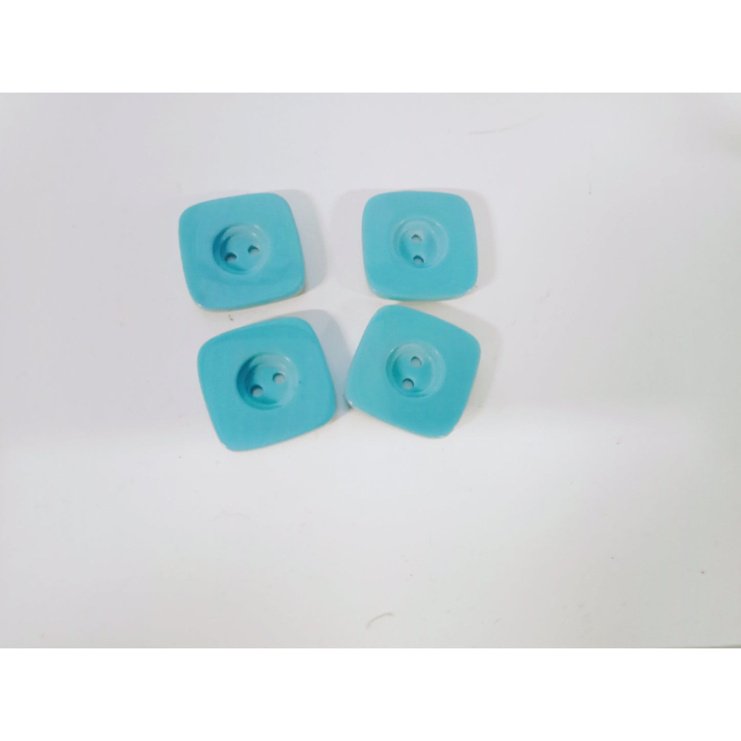 Baby blue square buttons